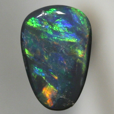 SOLID BLACK OPAL Orange to green with a hue of blue. SEE VIDEO